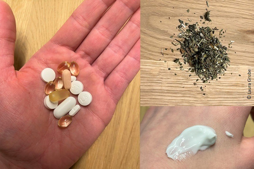 Lauras Tabletten und Vitamine, Kräuter und ihre eingecremte Hand.
